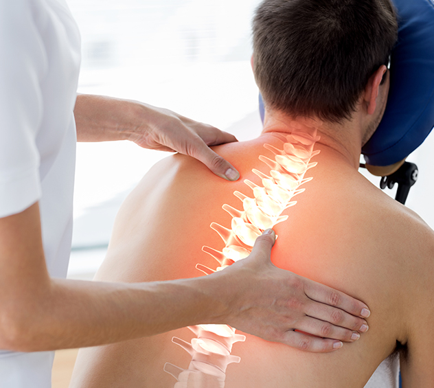 man getting adjusted by chiropractor with spine illuminated